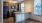 a kitchen with a marble island