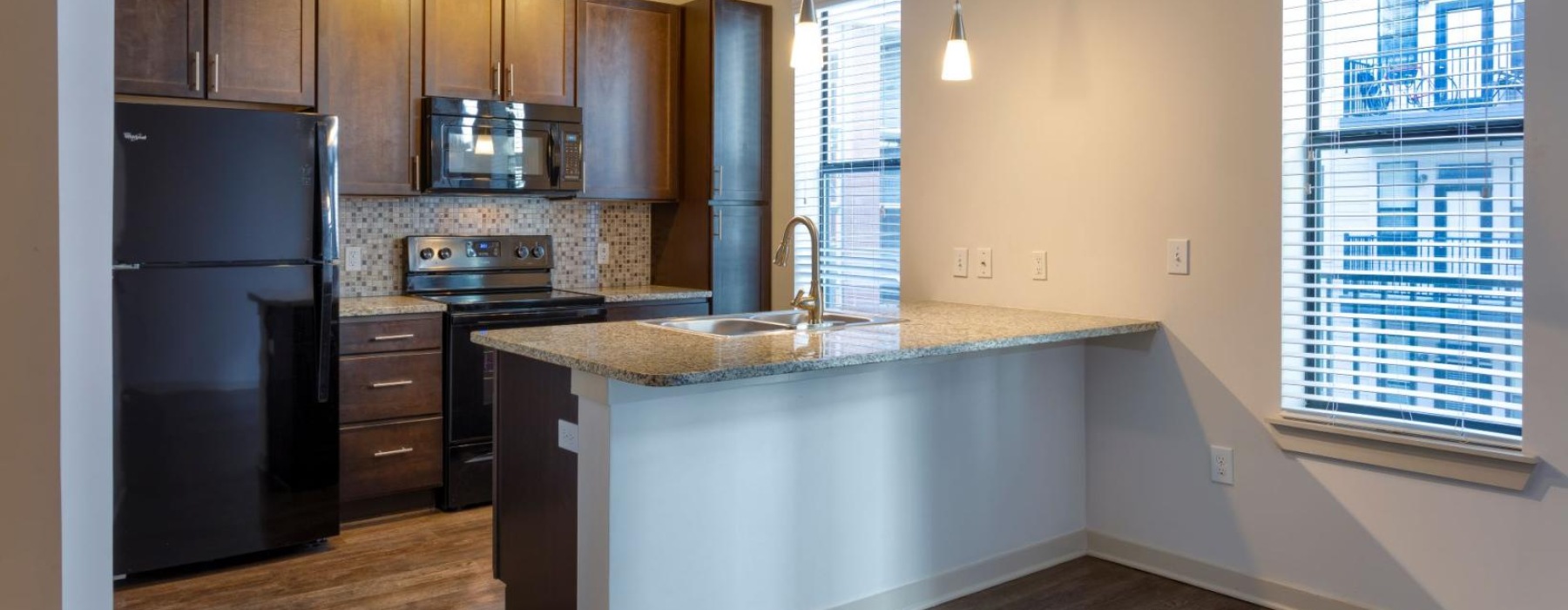 a kitchen with a marble island