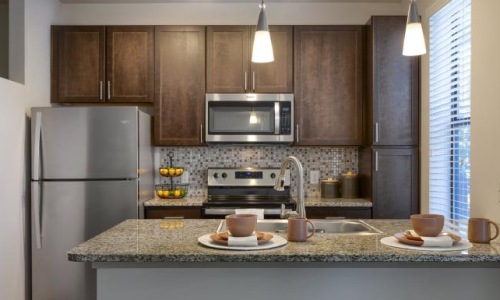 a kitchen with a marble countertop