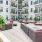 a courtyard with chairs and tables