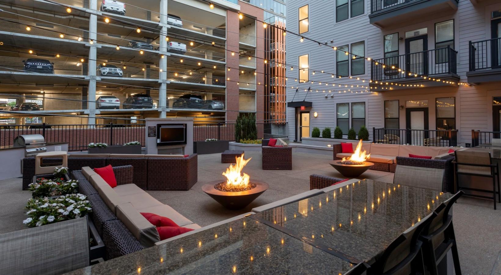 Settle into comfort at Artisan on 18th a fire pit in a courtyard