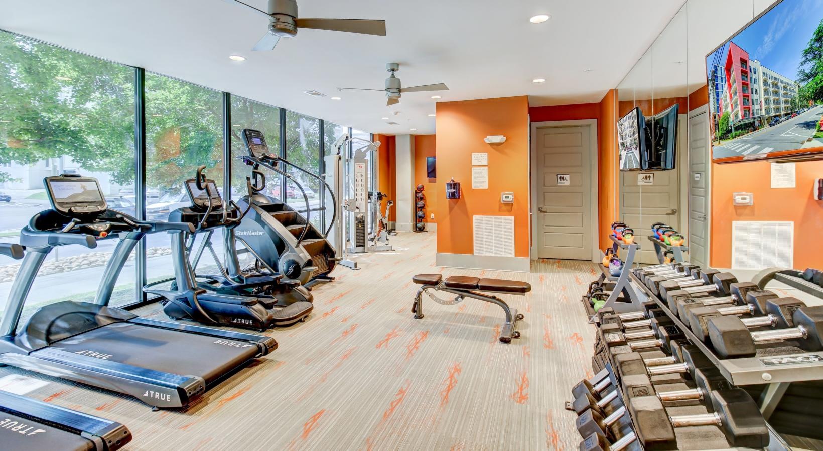 Get your workout on a room with exercise equipment