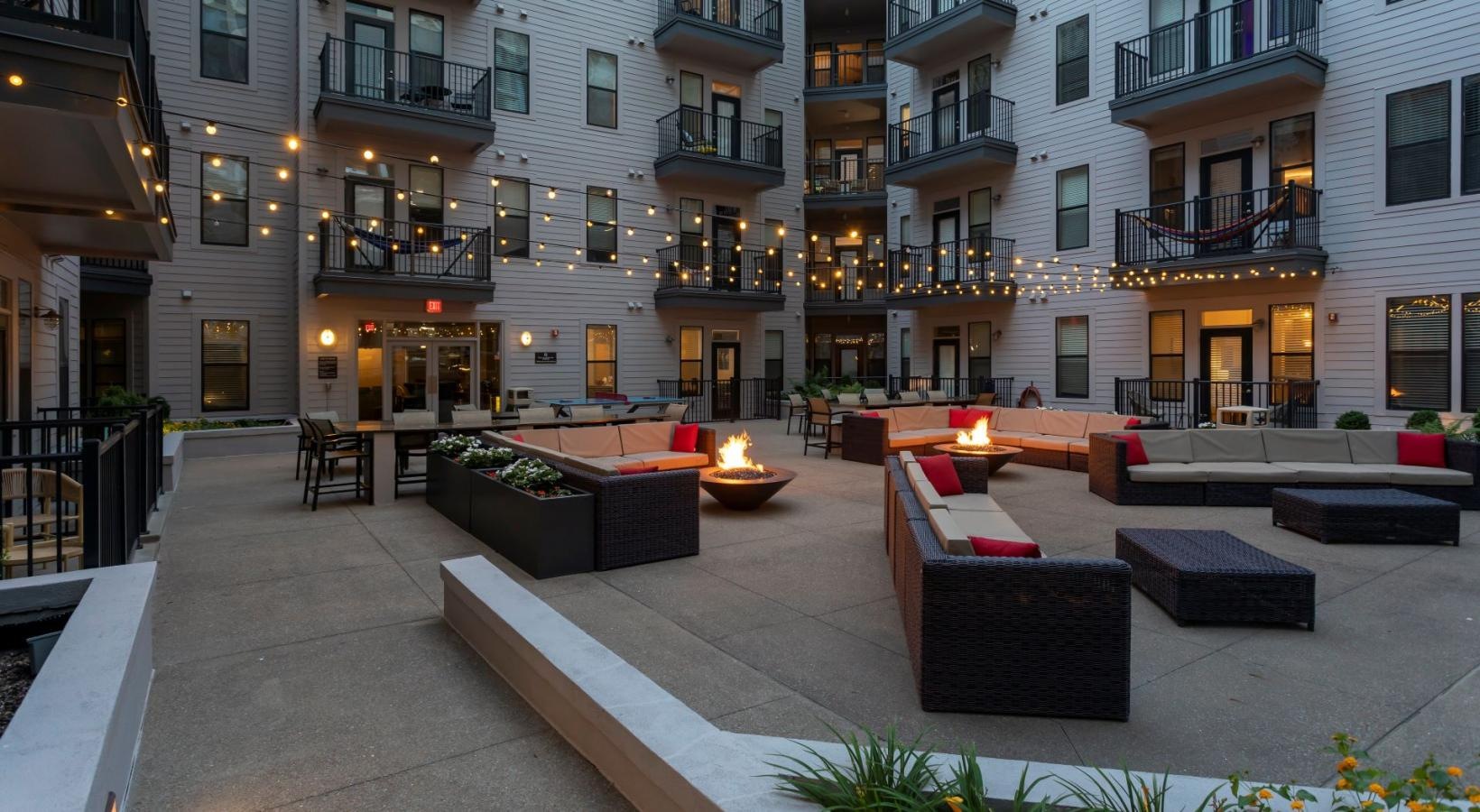The essence of exceptional living a courtyard with a fire pit and buildings