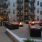 a courtyard with a fire pit and buildings