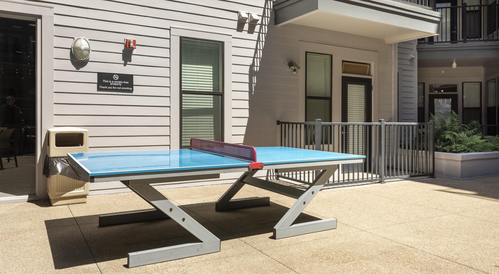 Find your perfect fit at Artisan on 18th a ping-pong table in front of a building
