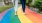 a pair of people walking on a colorful path
