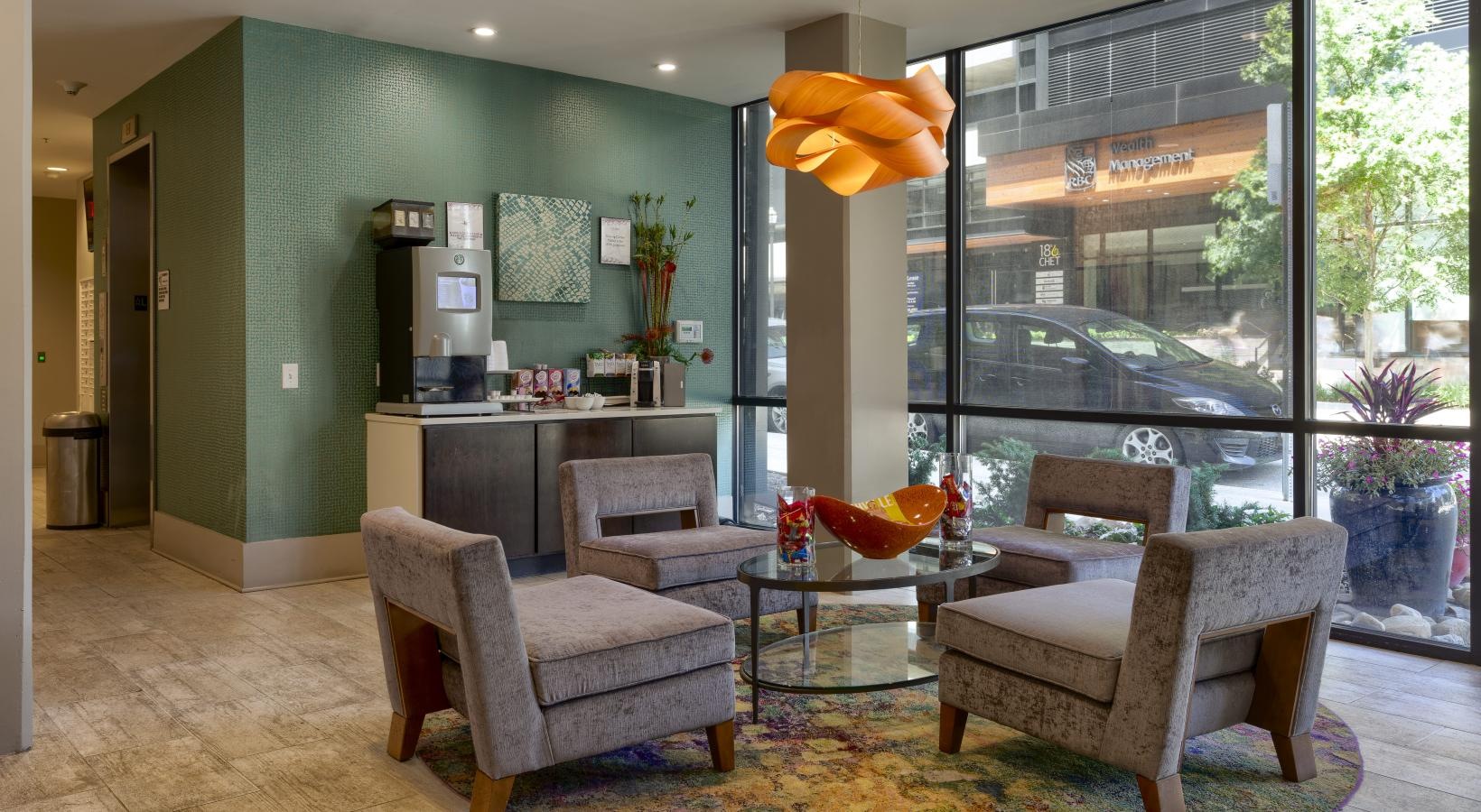 Find your perfect fit at Artisan on 18th a room with a large window and a coffee bar