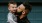 father holds and kisses his toddler son
