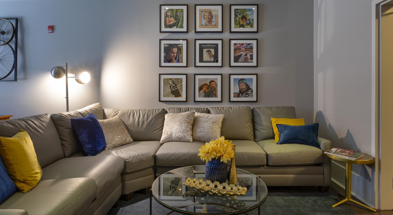 Settle into comfort at Artisan on 18th a living room with a couch and a coffee table