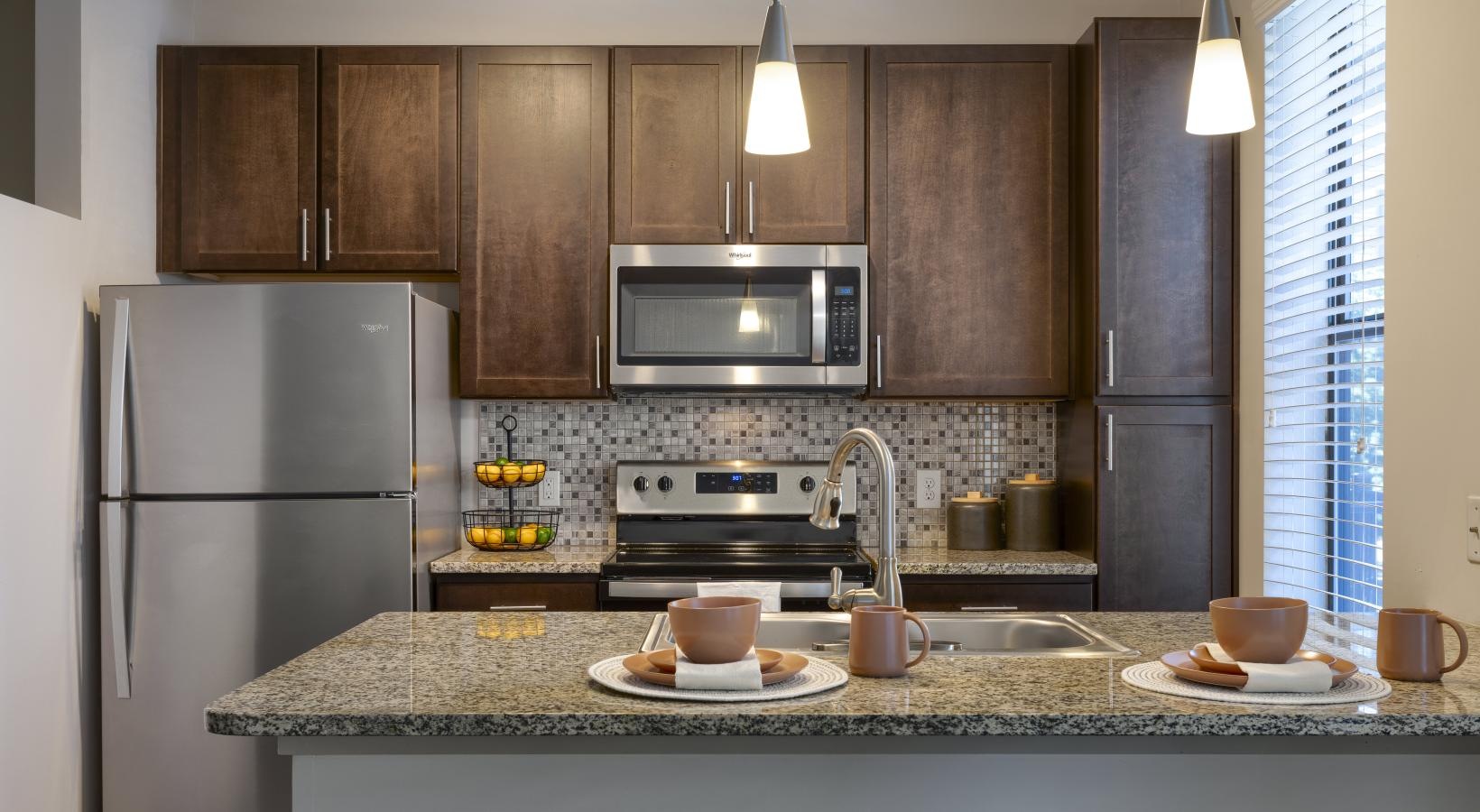 Spacious kitchens with thoughtful details a kitchen with a marble countertop