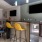 a room with a tv and chairs