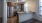 a kitchen with a marble counter top