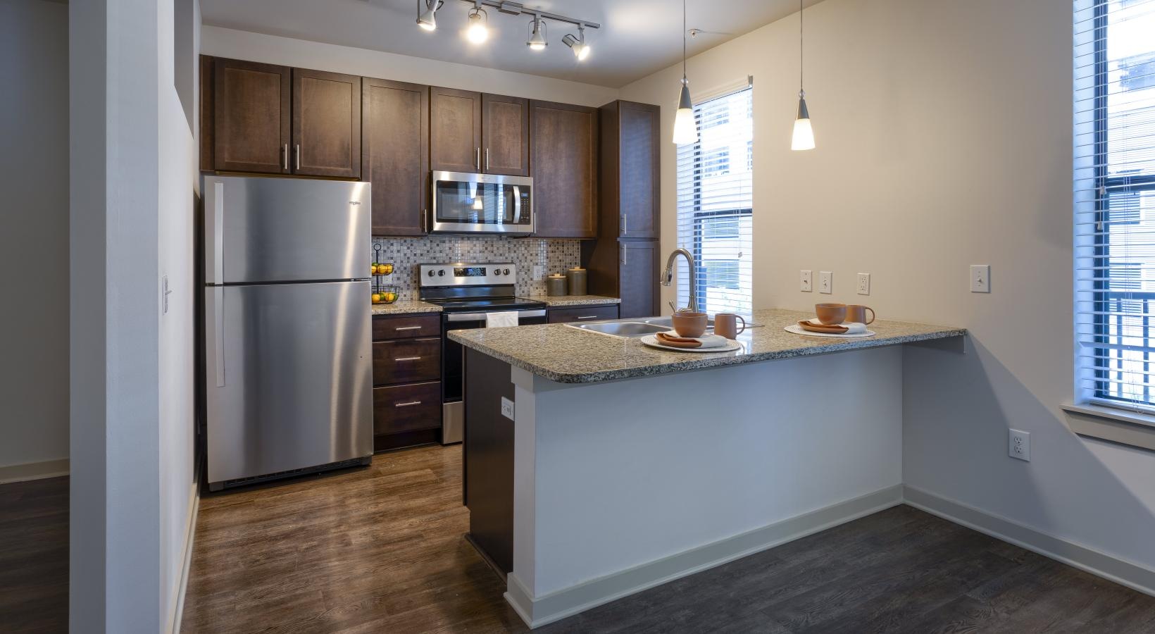 Beautiful kitchens with designer finishes a kitchen with a marble counter top