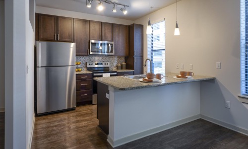 a kitchen with a marble counter top