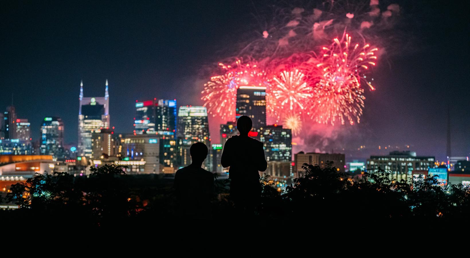 The essence of exceptional living a crowd of people watching fireworks