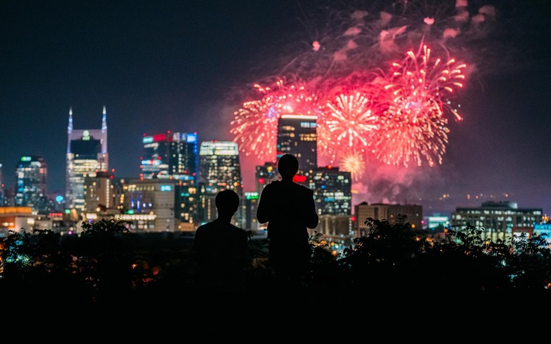 The essence of exceptional living a crowd of people watching fireworks