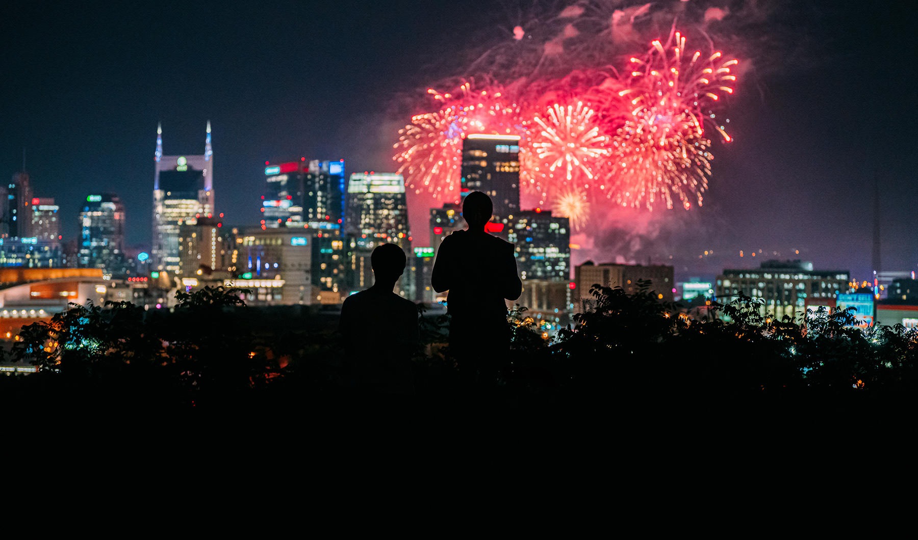 The essence of exceptional living a crowd of people watching fireworks