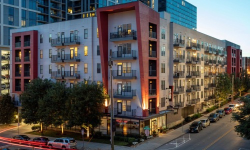 a street with cars and buildings along it